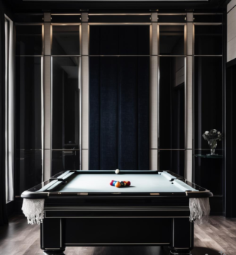 A modern billiards room with dark walls, a sleek pool table, and sophisticated lighting.