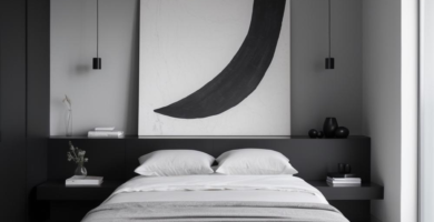 A minimalist bedroom featuring a black platform bed with white bedding and a gray throw blanket. A large abstract black and white painting hangs above the integrated black headboard, flanked by two black pendant lights, all set against a cool gray wall.