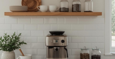 A modern kitchen coffee station featuring two natural wood floating shelves above a white subway tile backsplash and a dark countertop. A stainless steel espresso machine is centered on the counter, flanked by a potted green plant and glass jars filled with coffee beans, creating a warm and inviting coffee station setup.