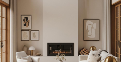 A spacious, modern living room featuring a neutral color palette of cream, beige, and light wood. The room includes a large sofa, two armchairs, a wooden coffee table, and a built-in fireplace, all illuminated by natural light from tall windows.
