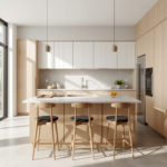 Light oak lower cabinets and matte white upper modules with a light quartz island under linear pendant lights.